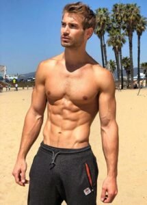 Shirtless guy showing off his chest and abs